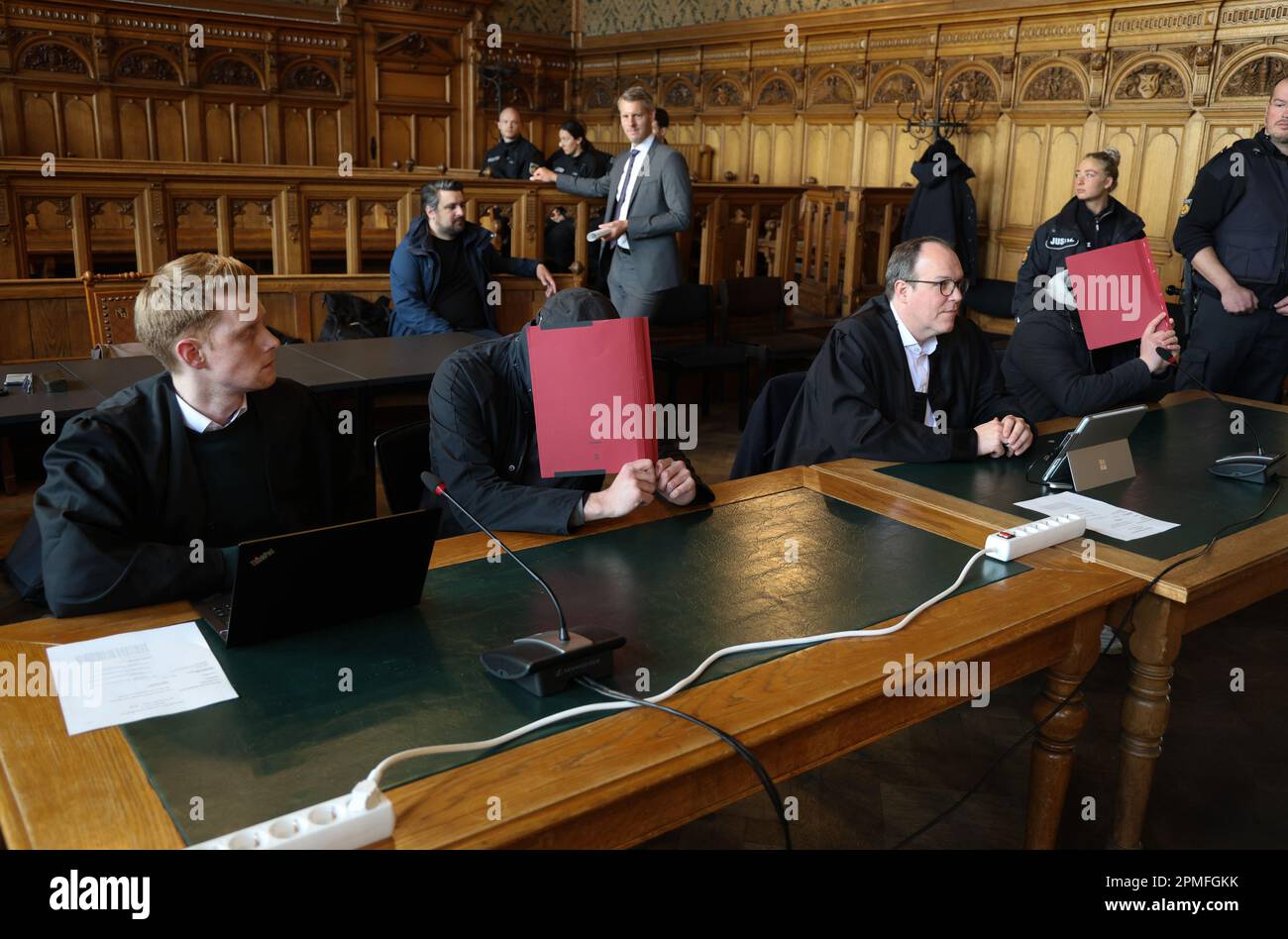 Bremen, Germany. 13th Apr, 2023. Two defendants wait with their defense