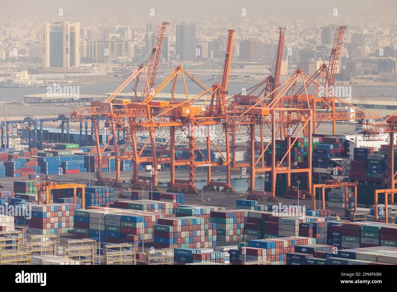 Jeddah, Saudi Arabia - December 22, 2019: Gantry cranes and stacked containers at Jeddah Islamic Seaport Stock Photo