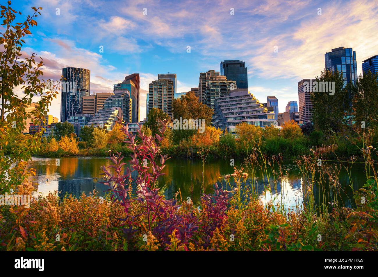 Sunset above city skyline of Calgary with Bow River, Canada Stock Photo ...