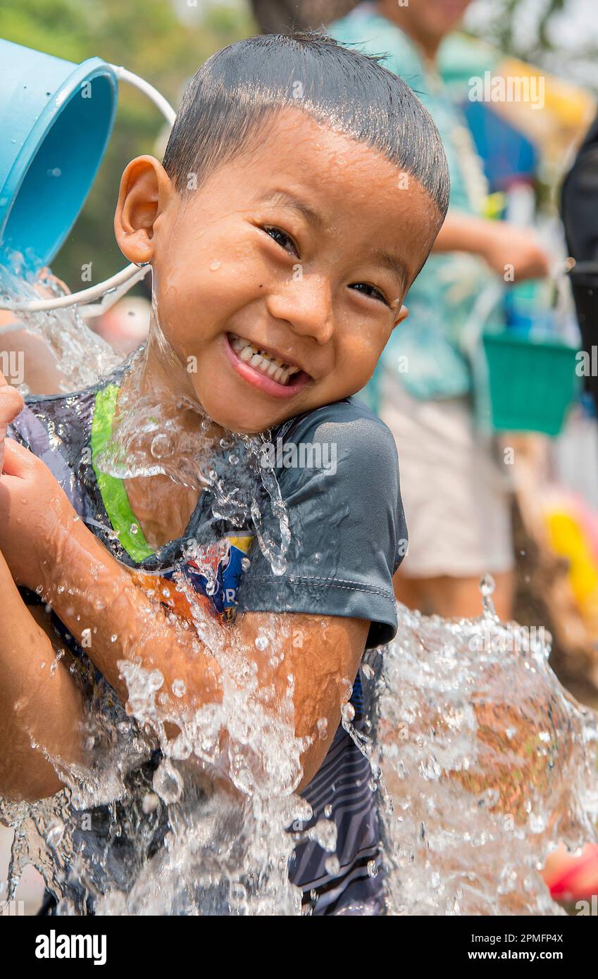 Boy splashing at Songkran water festival Chiang Mai, Thailand Stock Photo