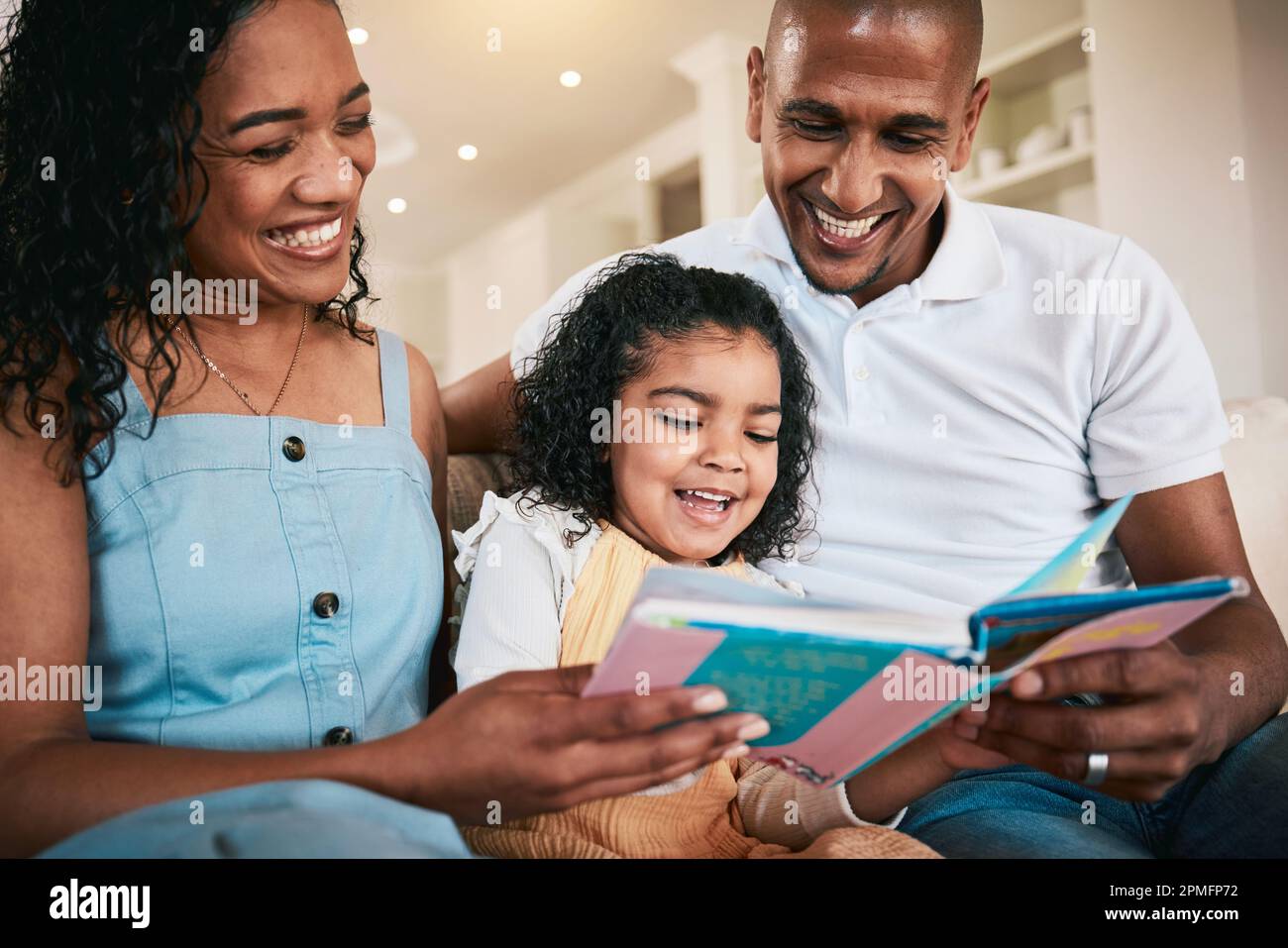 Happy family reading comic books together with laughter and joy