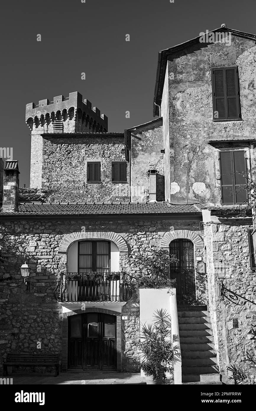 stone houses and the tower of a medieval castle in the town of Capalbio