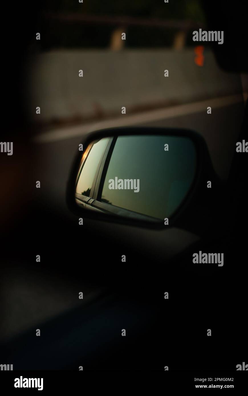 Car side mirror in sunset light Stock Photo Alamy