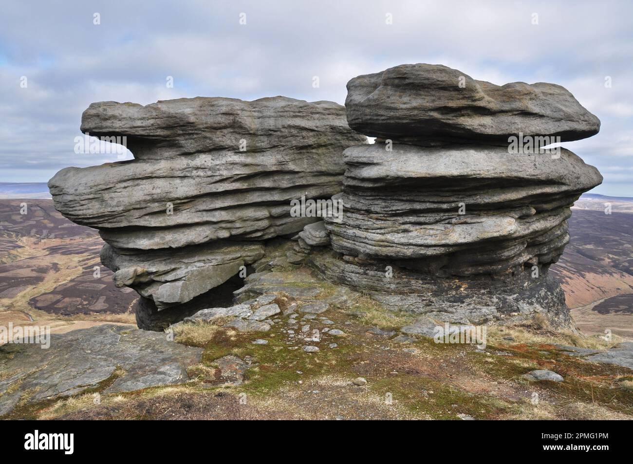 Rock formation looking like heads, on the North edge of Kinder Scout ...