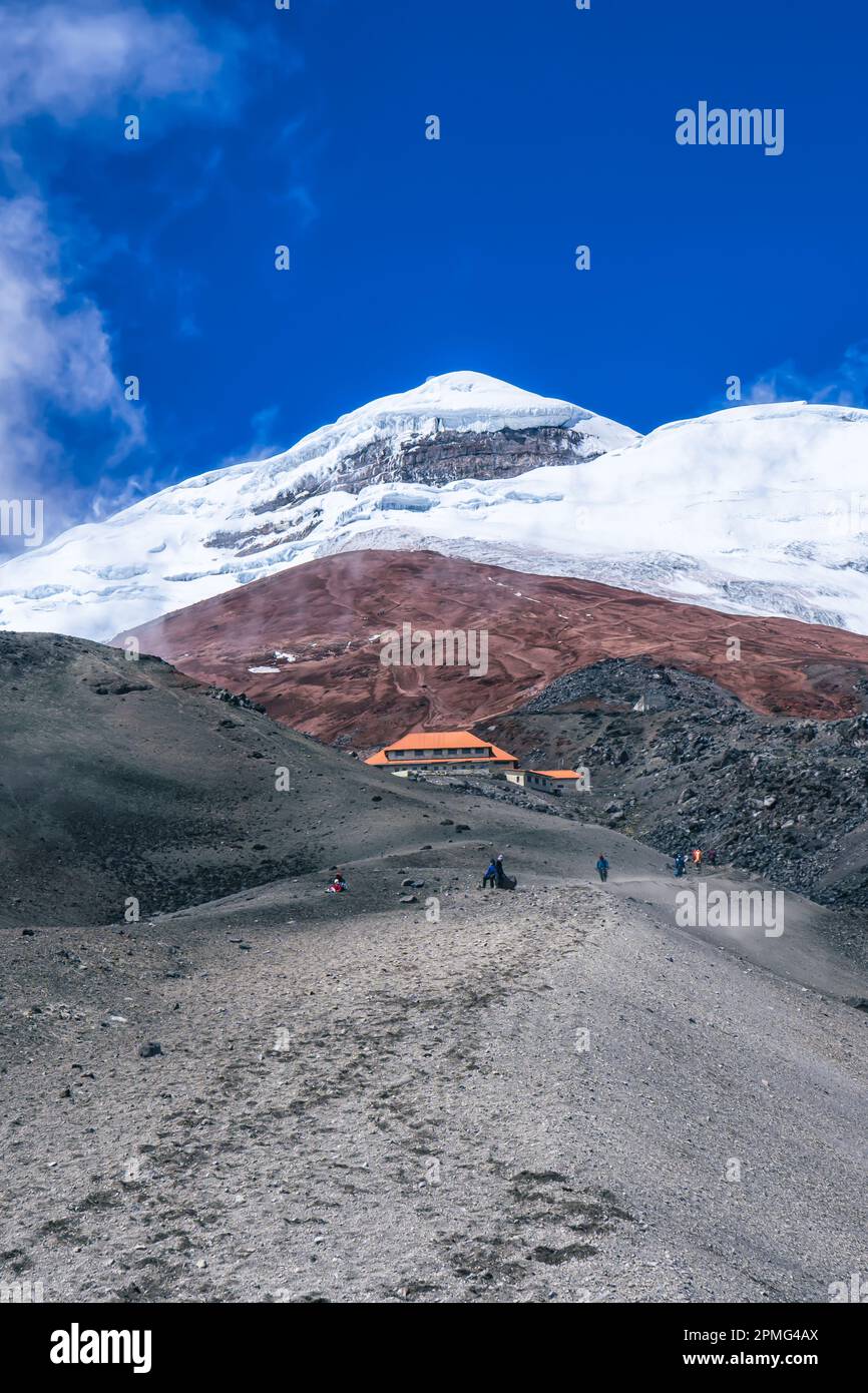 The magnificent Cotopaxi Volcano Ecuador with its snow capped peak and swirling cloud Stock Photo