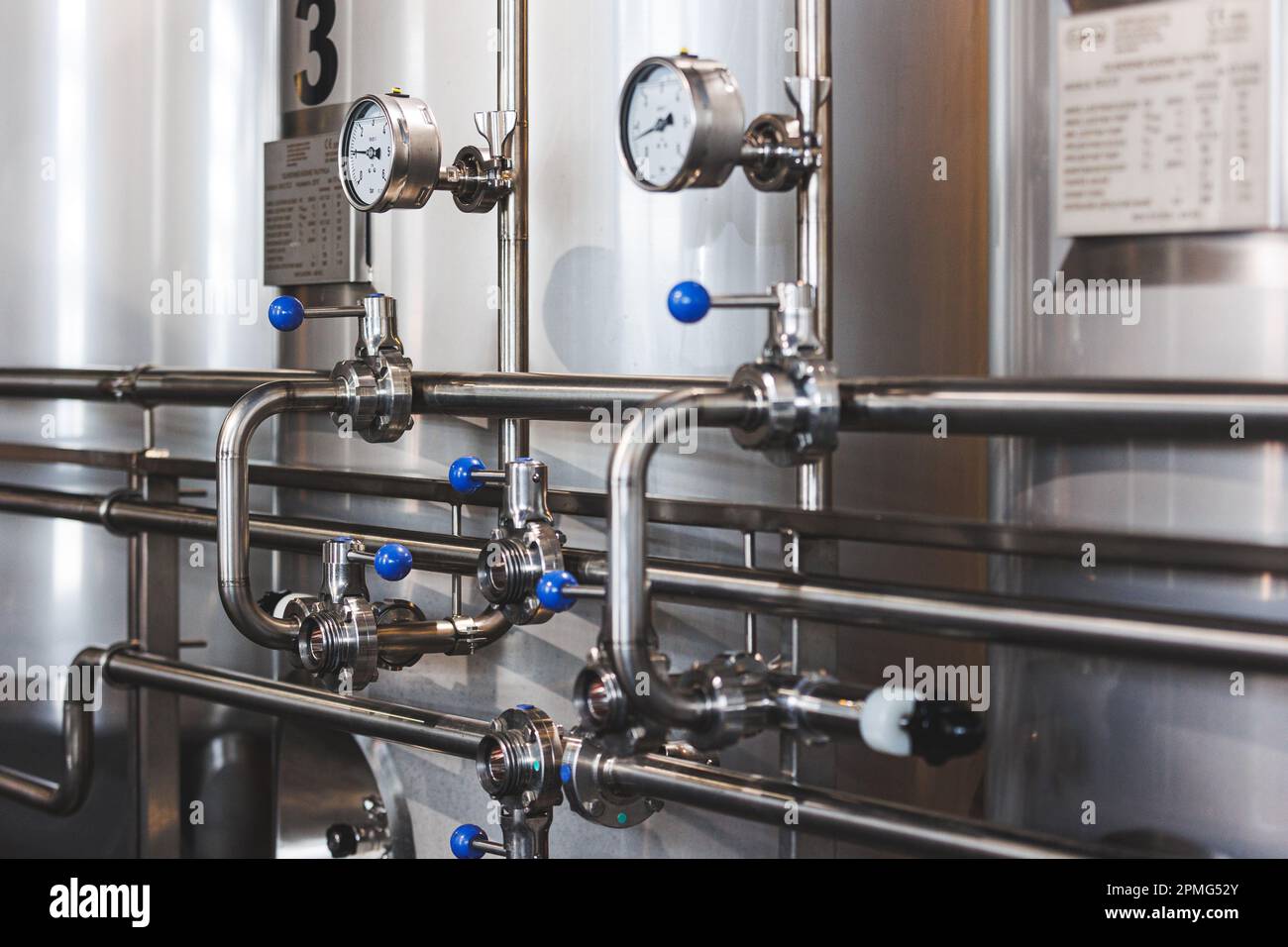 Beer brewing . Commercial brewing equipment close up shot. Industrial ...