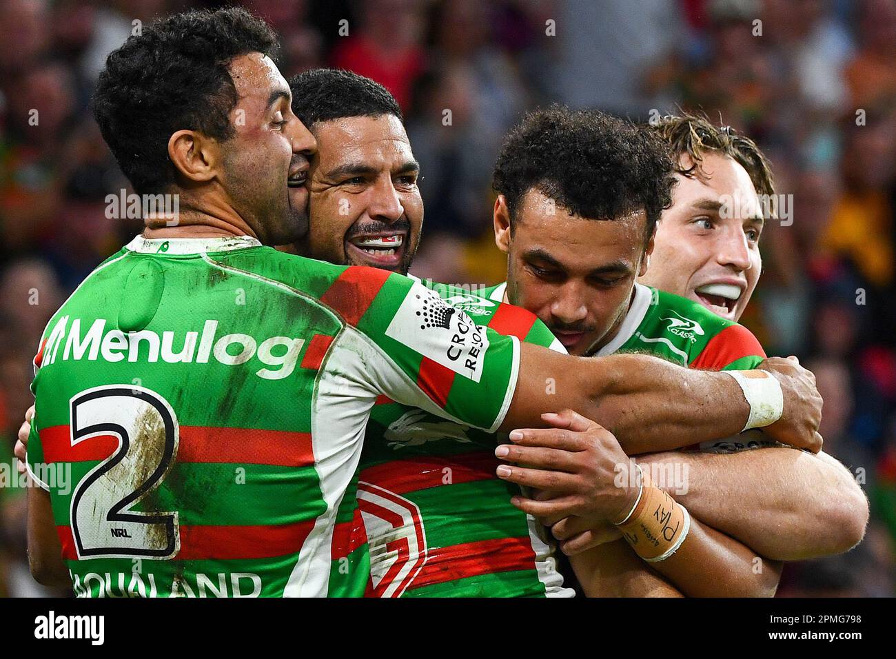 Cody Walker of the Rabbitohs celebrates a try with team mates during