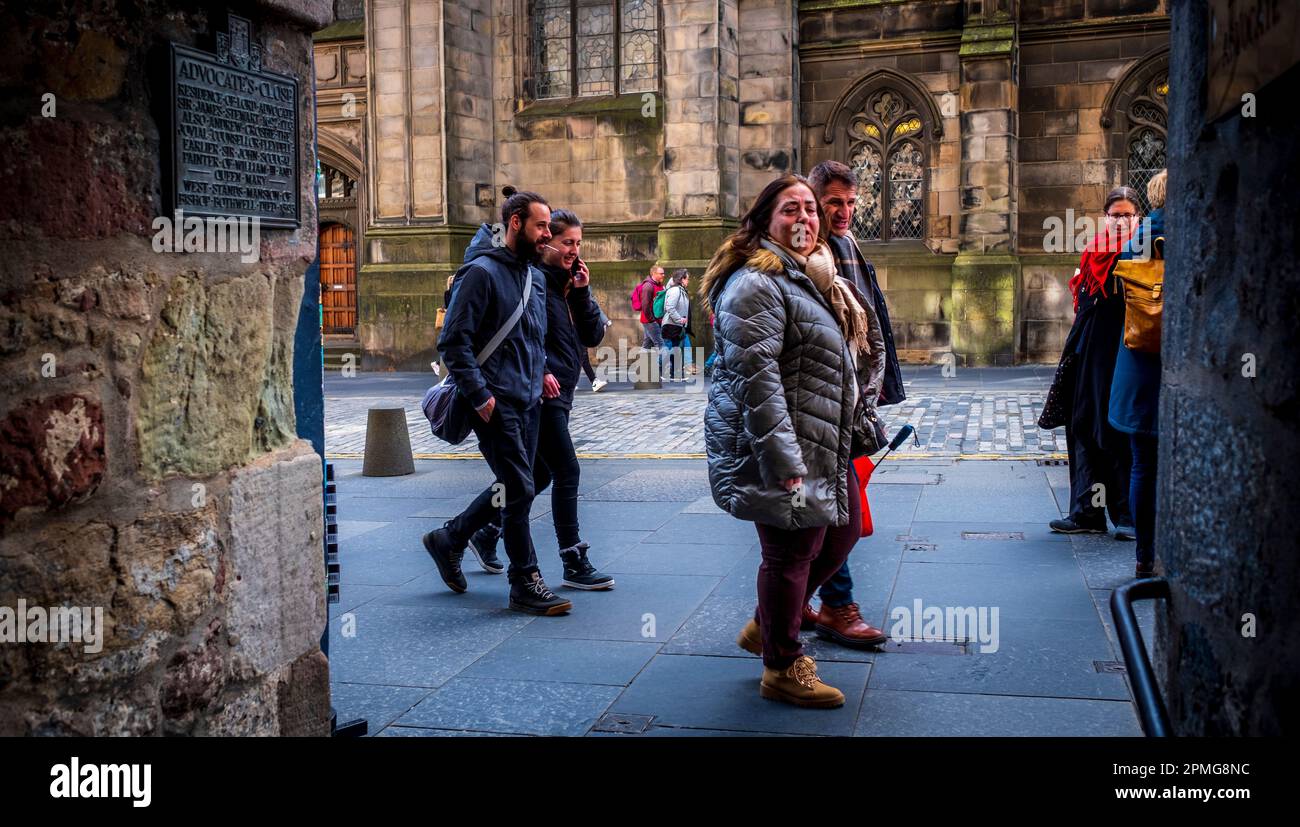 Tourists in Edinburgh's High Street – part of the Royal Mile. Stock Photo