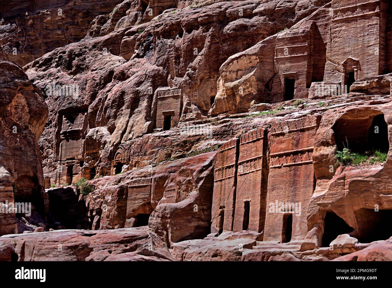 Street of facades  Petra city Nabataean caravan-city rock-cut façades Jordan carved sandstone rock desert. Stock Photo