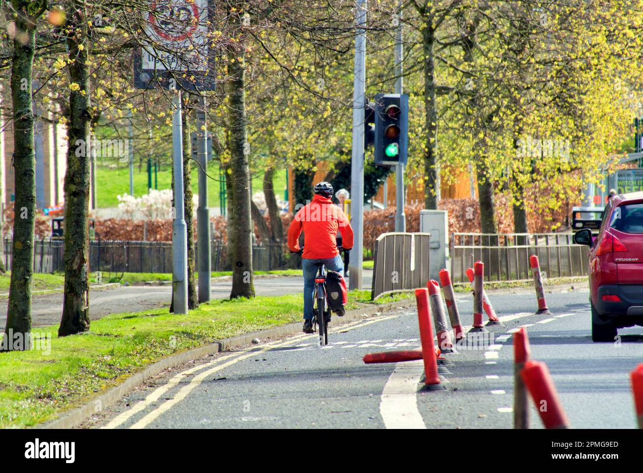 cyclist on cycle lane on the A82 great western road Stock Photo