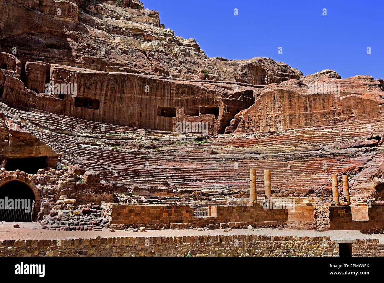 Roman Theatre Petra city Nabataean caravan-city rock-cut façades Jordan carved sandstone rock desert. Stock Photo