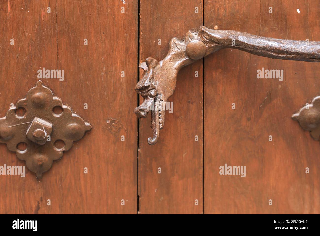 Beautiful golden door handle with mythological dragon shape with wings