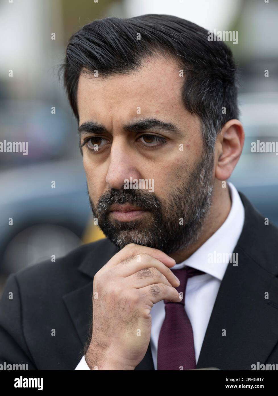 First Minister Humza Yousaf speaking to the media, after he visited a nursery at Crookston Castle Primary School, Glasgow, to see how a project to integrate child poverty interventions and bring services together across the city is having a positive impact for families. Picture date: Thursday April 13, 2023. Stock Photo