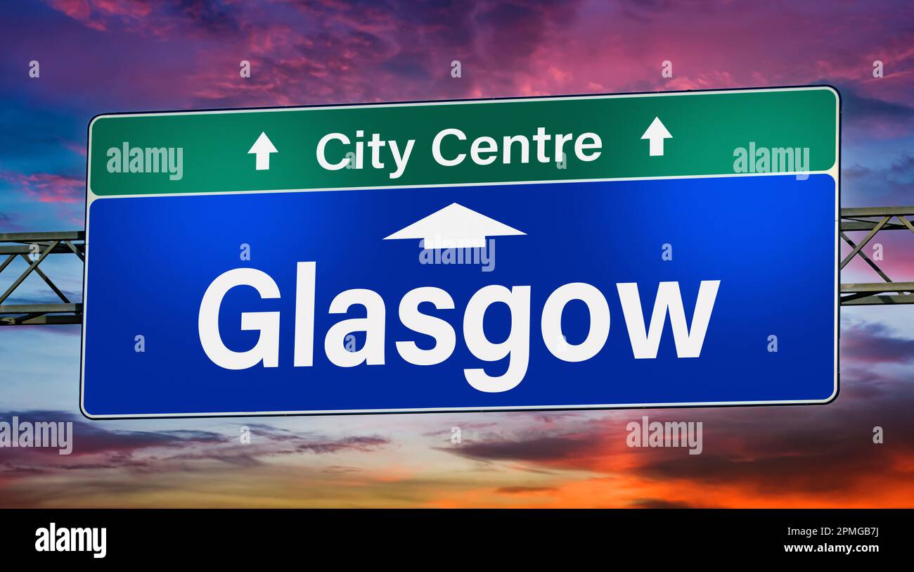 Road sign indicating direction to the city of Glasgow. Stock Photo