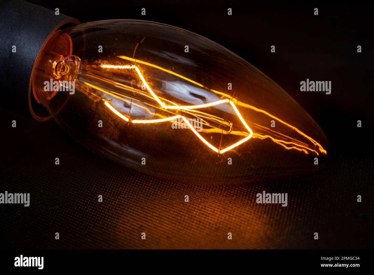 Light bulb on black, South Africa in Electricity disaster Stock Photo