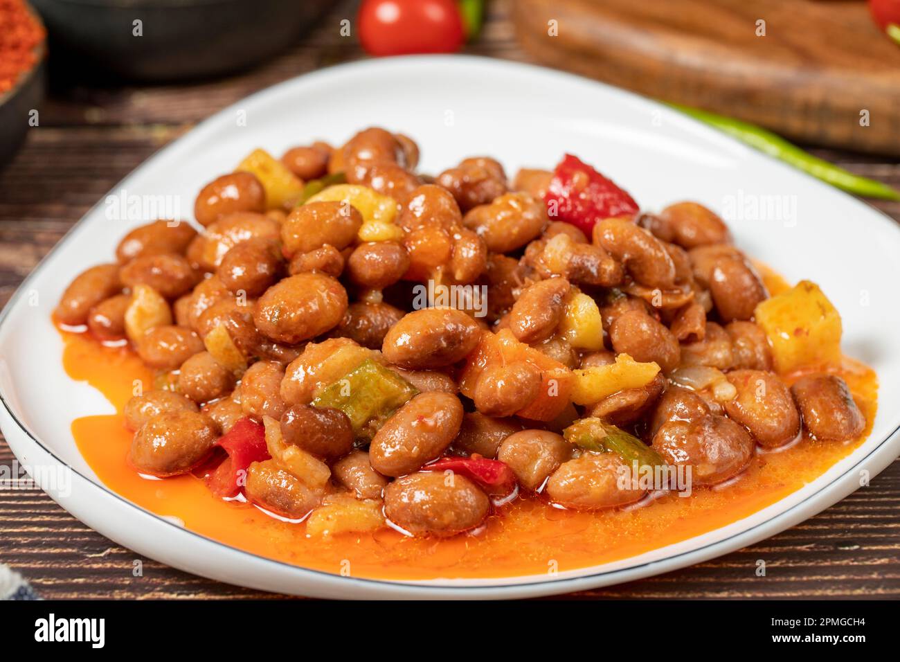 Red kidney beans dish with olive oil on wood floor. Healthy foods
