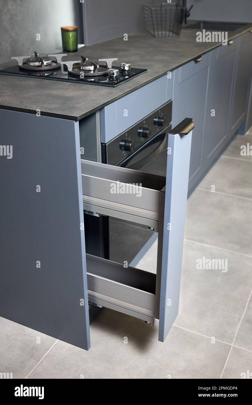 Vertical pull out rack drawer. Flush up slip handle finger pull