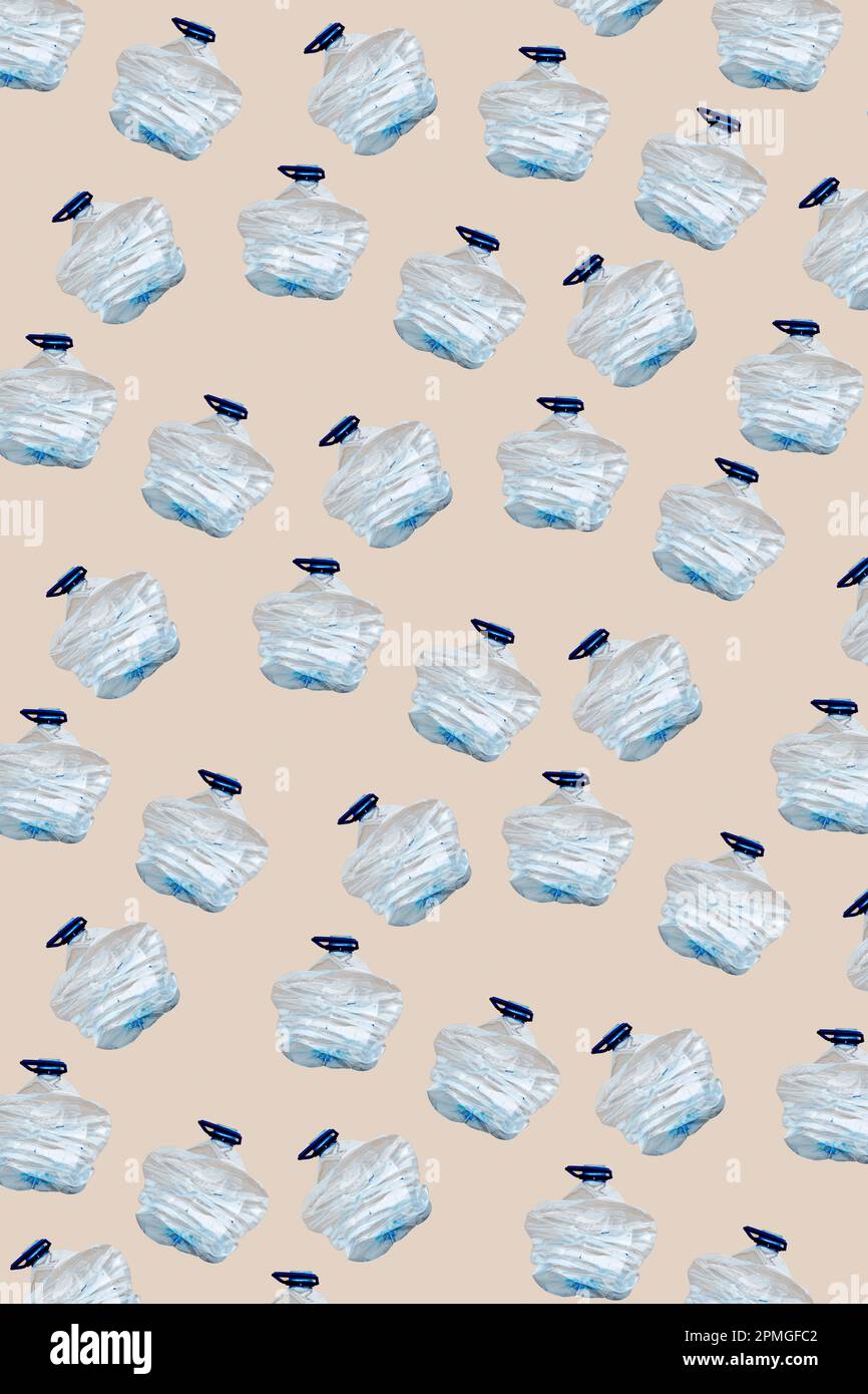some smashed plastic bottles arranged in different lines forming a pattern on a beige background Stock Photo