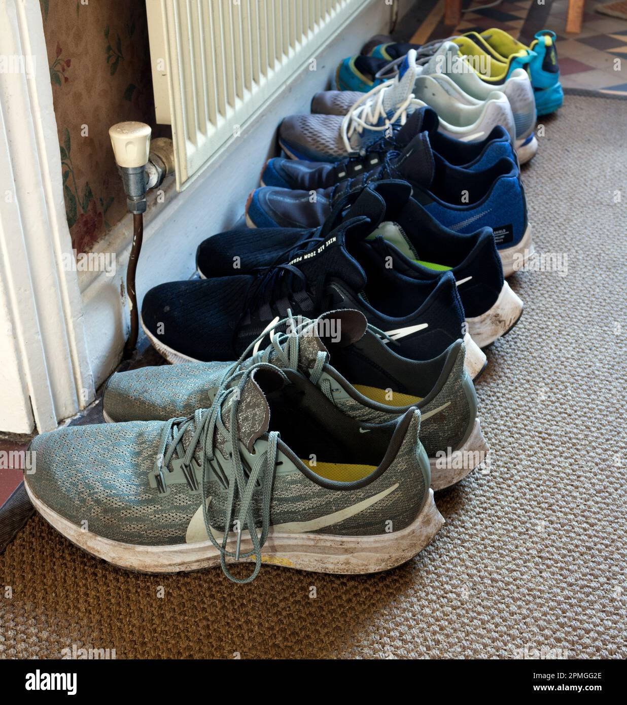 Running shoes in the hall of a house. Stock Photo