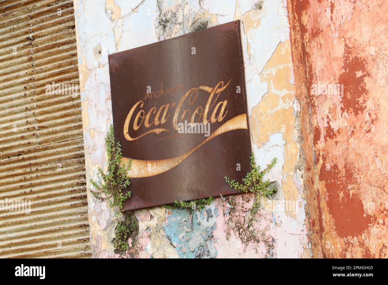 Rusty Coca-Cola sign on a wall of the Ghost Town of Varosha, Farmagusta (Gazimagusa), Turkish Republic of Northern Cyprus. Stock Photo