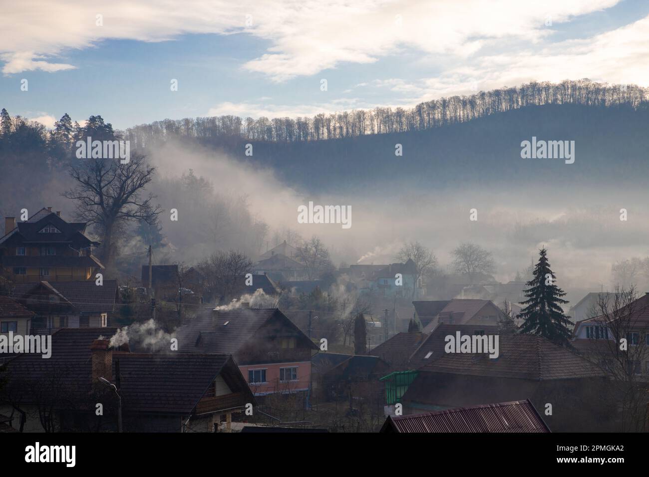 Landscape with fog and smoke above a village in early morning Stock ...