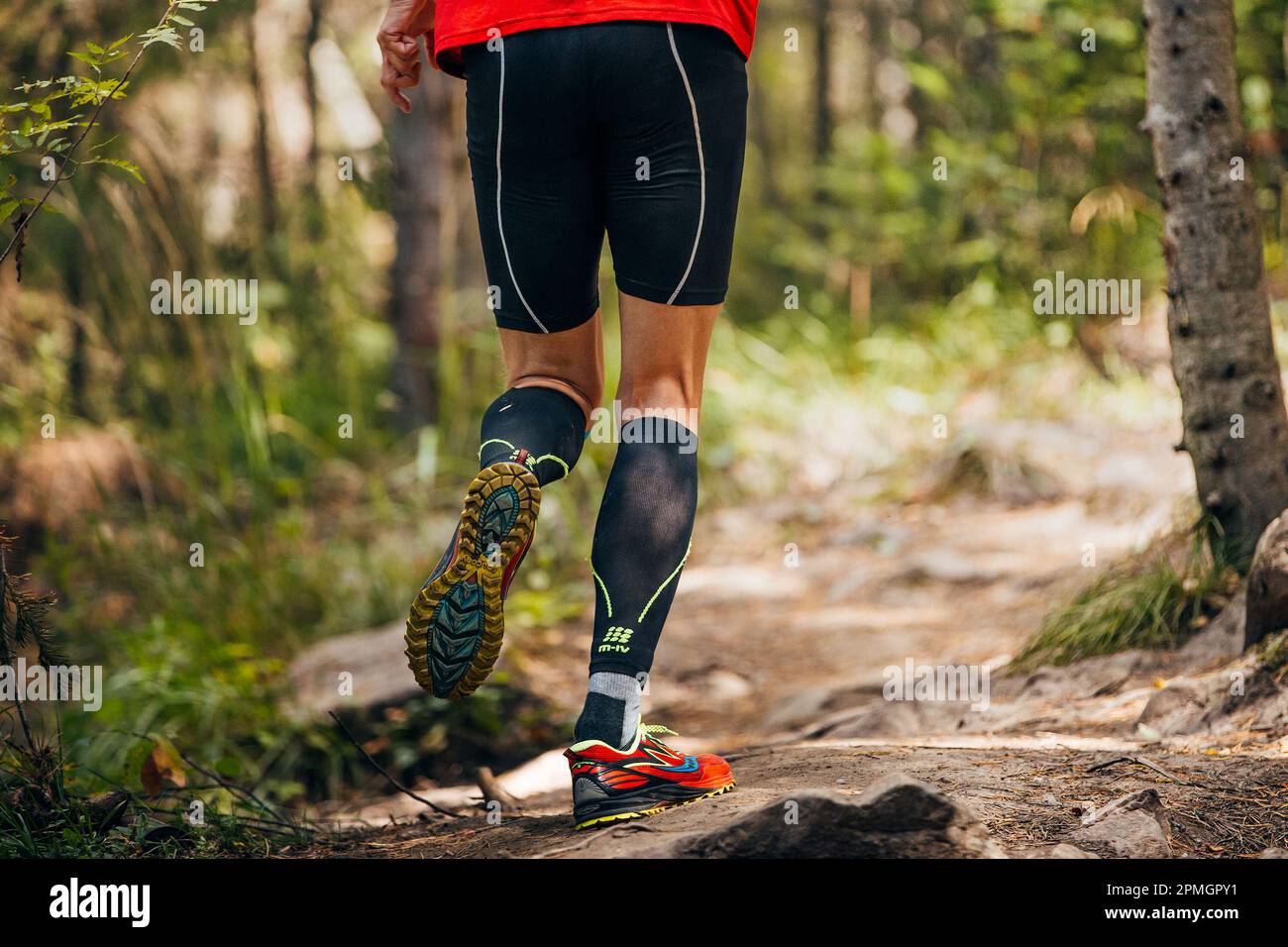 Zlatoust, Russia - August 28, 2016: male runner run forest trail marathon in Cep compression sleeves and Saucony running shoes Stock Photo
