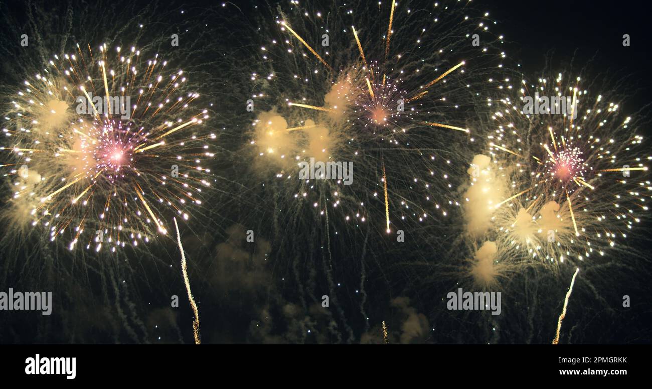 New year's eve fireworks display celebration loop seamless of real fireworks background with abstract multicolor big shining glowing fireworks show w Stock Photo