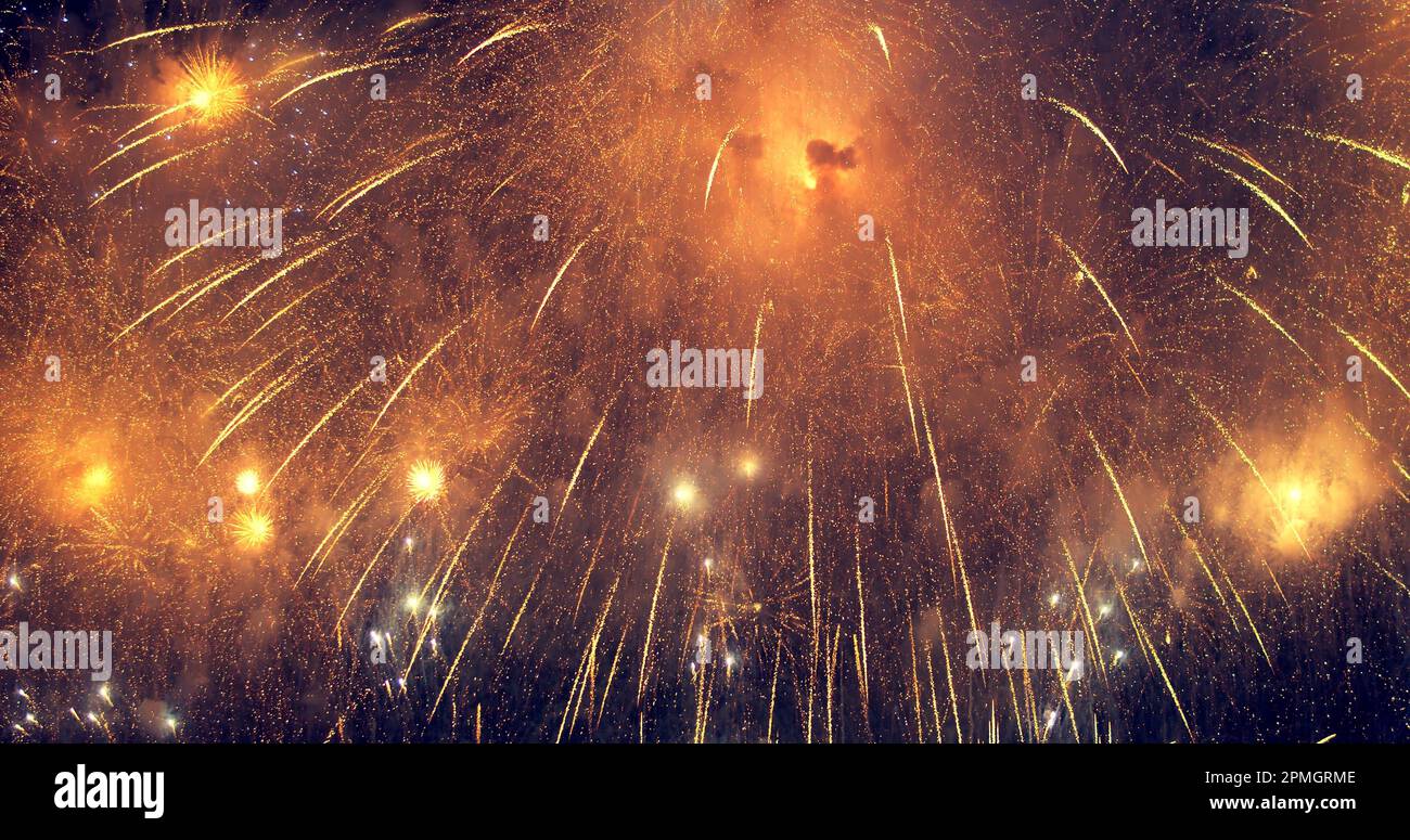 New year's eve fireworks display celebration loop seamless of real fireworks background with abstract multicolor big shining glowing fireworks show w Stock Photo