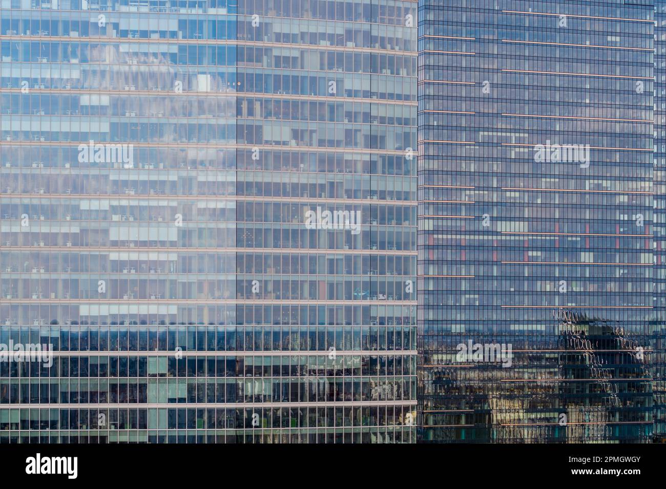 City reflection in glass skyscraper office window, aerial landscape Stock Photo