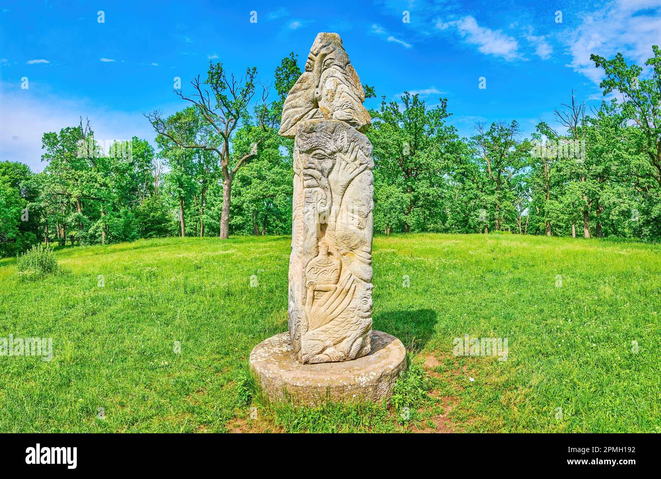 Pagan Slavic Idols with images of Gods on the lawn of Sofiyivka Park, Uman, Ukraine Stock Photo