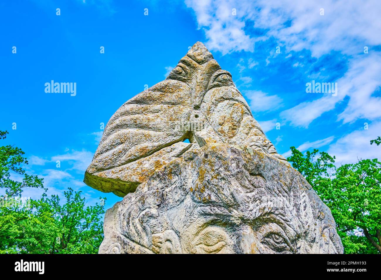 Pagan Slavic Idol with images of ancient Gods, Sofiyivka Park arboretum, Uman, Ukraine Stock Photo