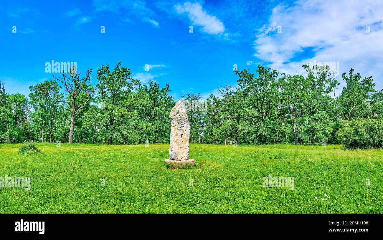 Panorama of the lawns of Sofiyivka Park with stone sculpture of Pagan Slavic Idol, Uman, Ukraine Stock Photo