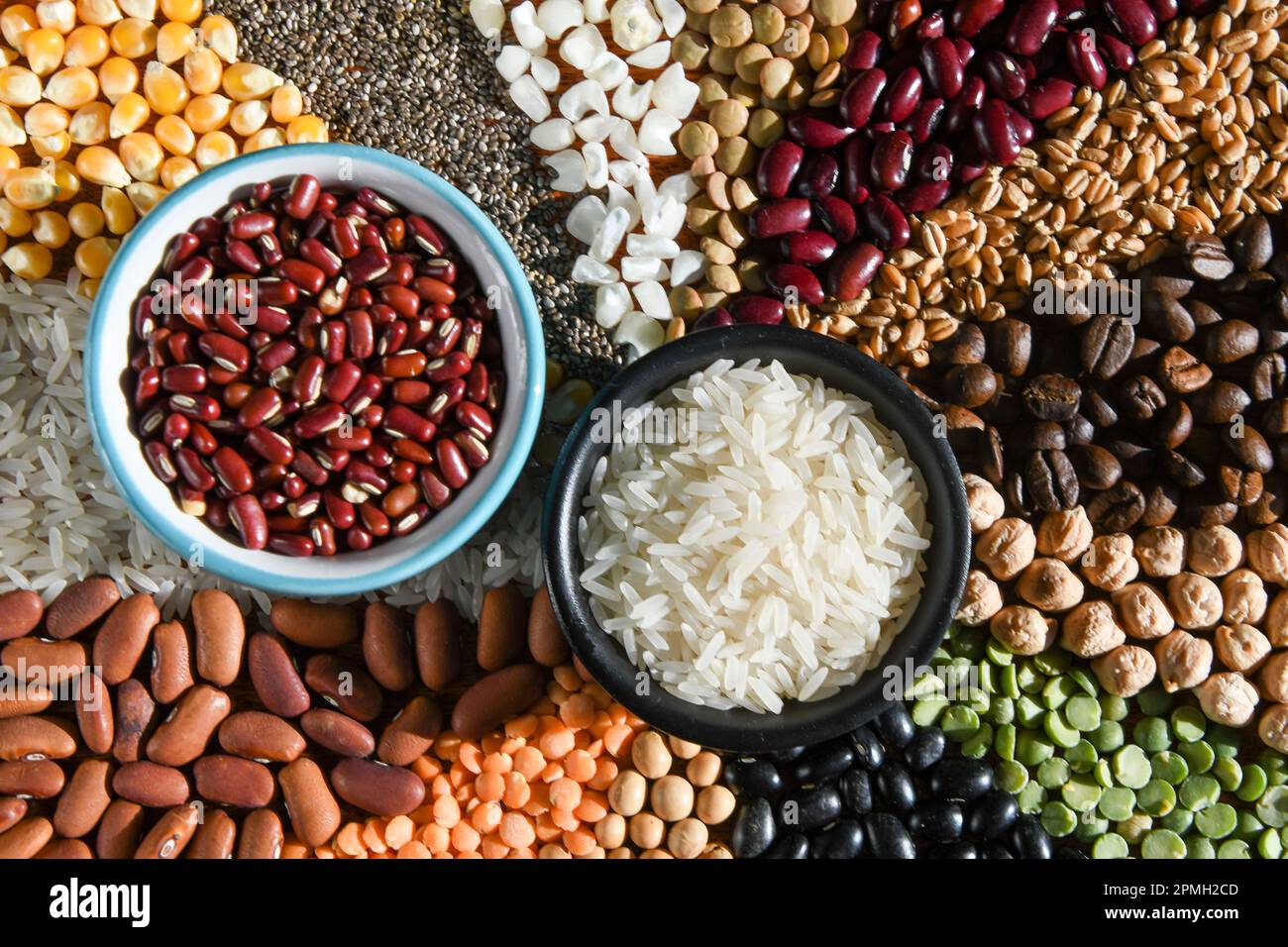 Raw Rice Beans Bowl with raw white rices and beans on various seeds Stock Photo - Alamy