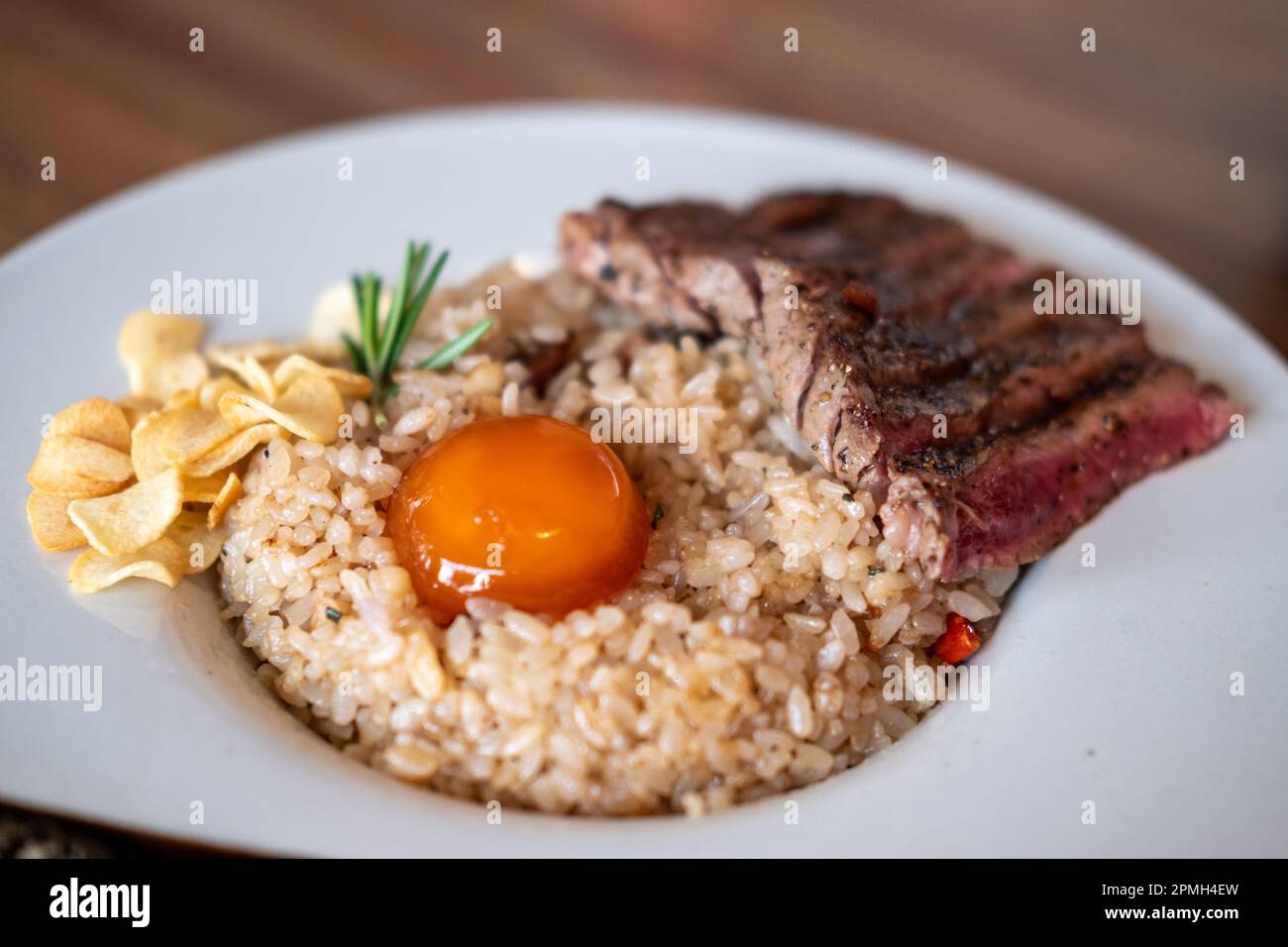 Beef with beef fat fried rice, a dish consisting of a bowl of rice