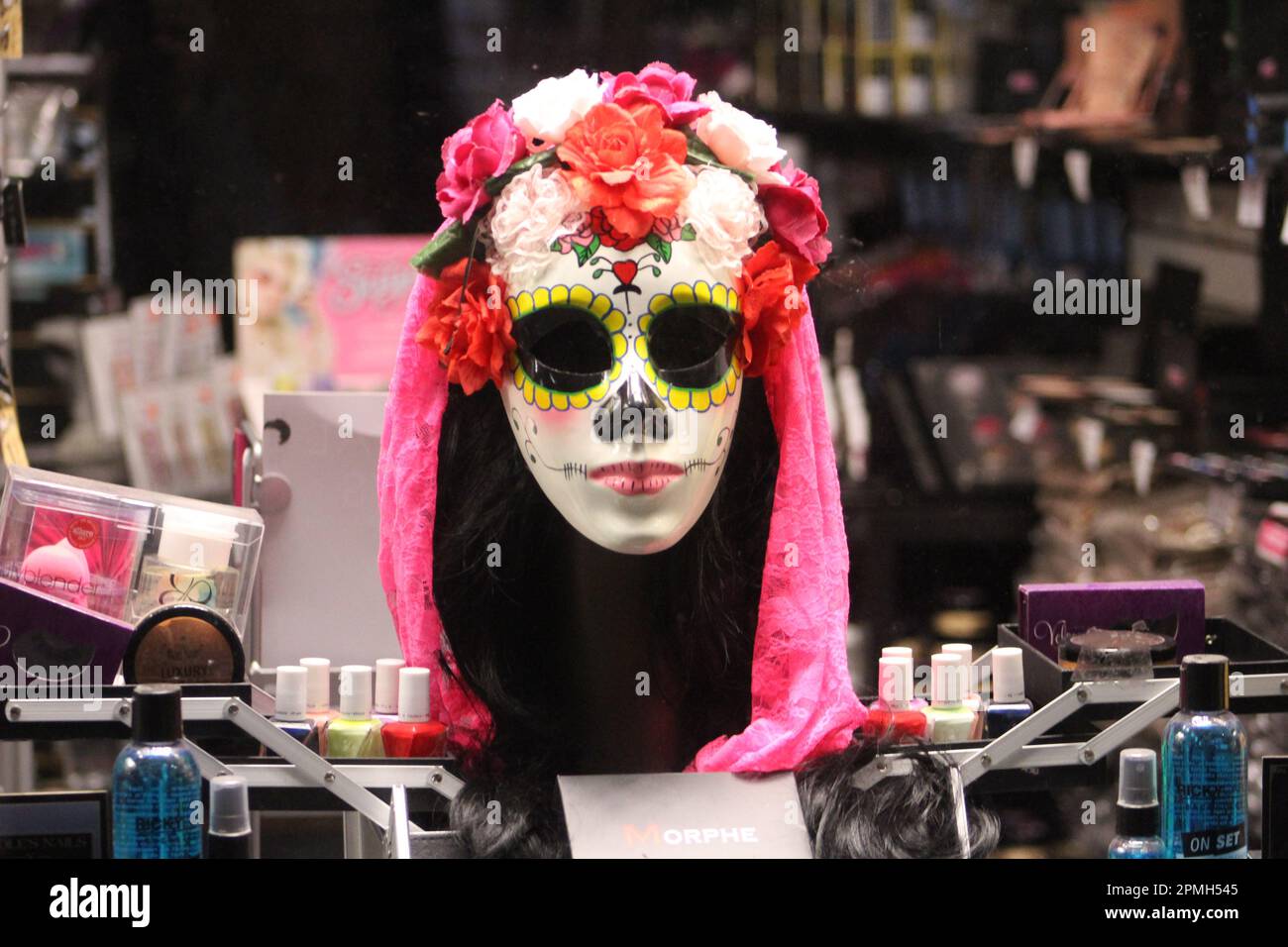 NEW YORK, USA - NOVEMBER 14, 2016 5th Avenue in the evening Day of the Dead mask in a shop window Stock Photo