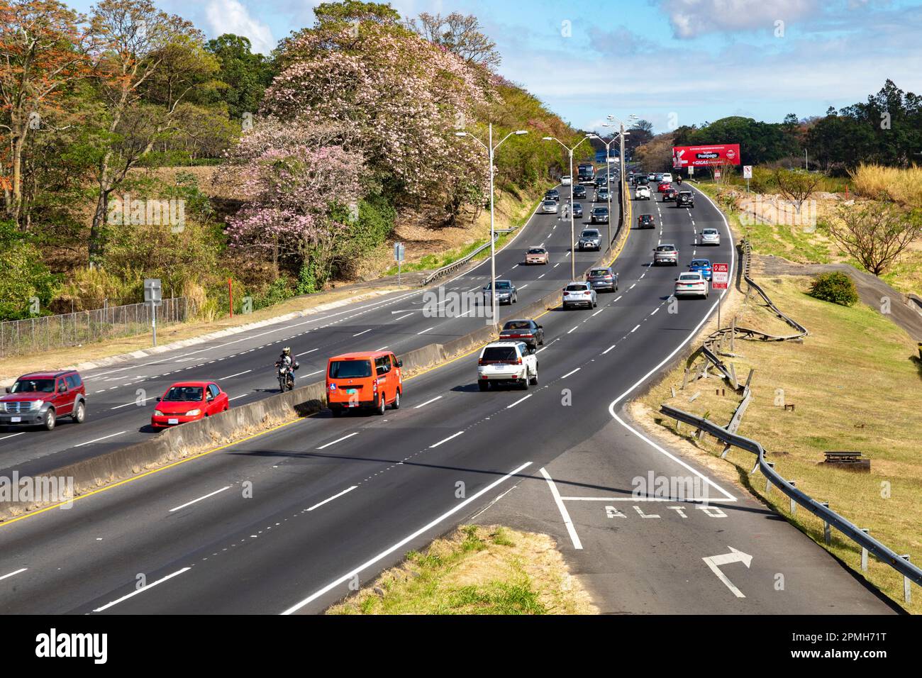San Jose, Costa Rica - The Pan American Highway in the suburbs of San Jose. The highway stretches 19,000 miles from Prudhoe Bay, Alaska to the tip of Stock Photo