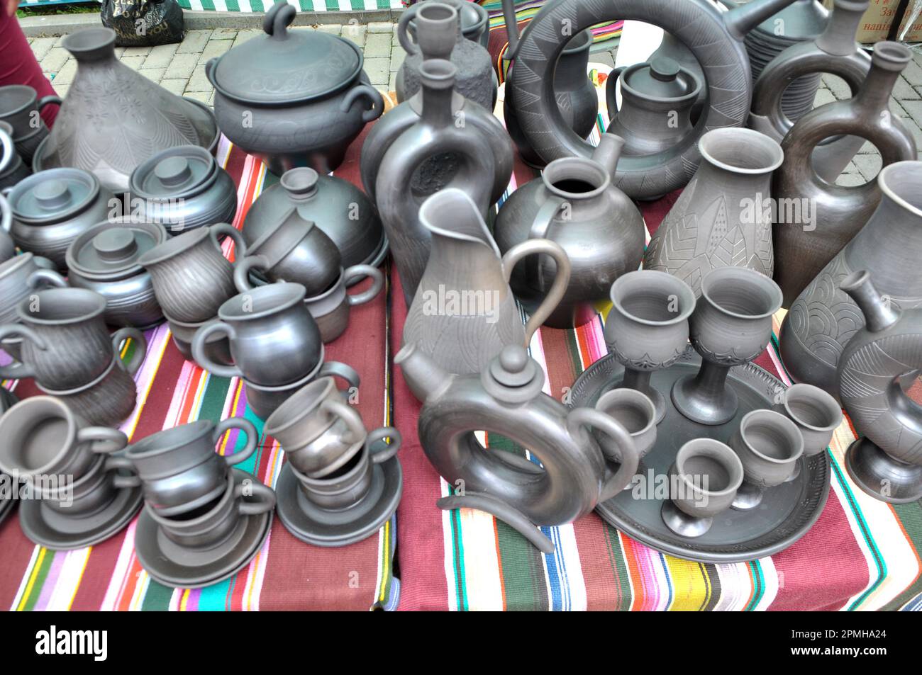 A variety of pottery made by folk craftsmen from clay. Stock Photo
