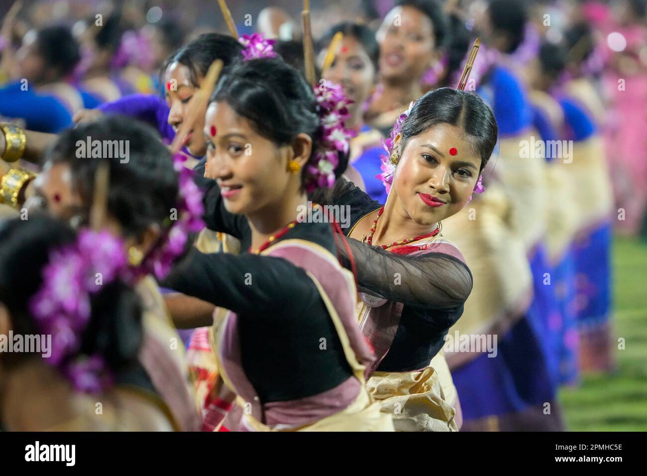 Assamese dancers in traditional attire perform as they attempt Guinness