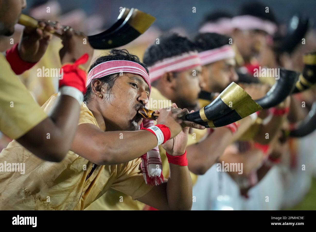 Assamese dancers in traditional attire perform as they attempt Guinness