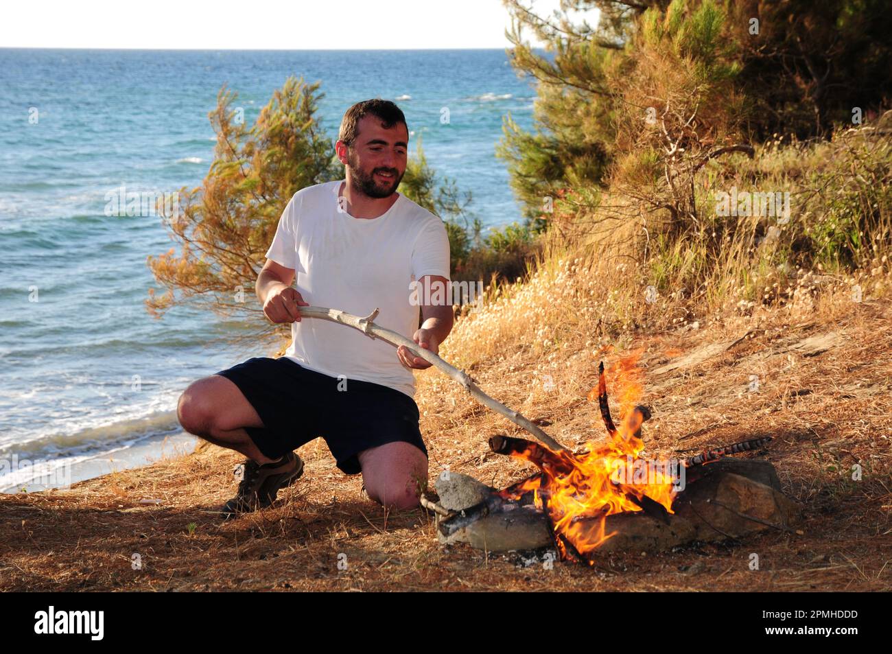 Campers burning fire in Turkey Stock Photo