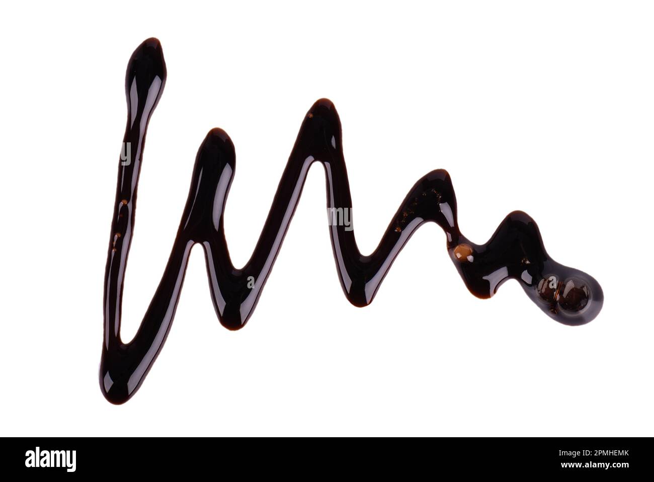 Chocolate syrup drizzle isolated on white background. Splashes of sweet