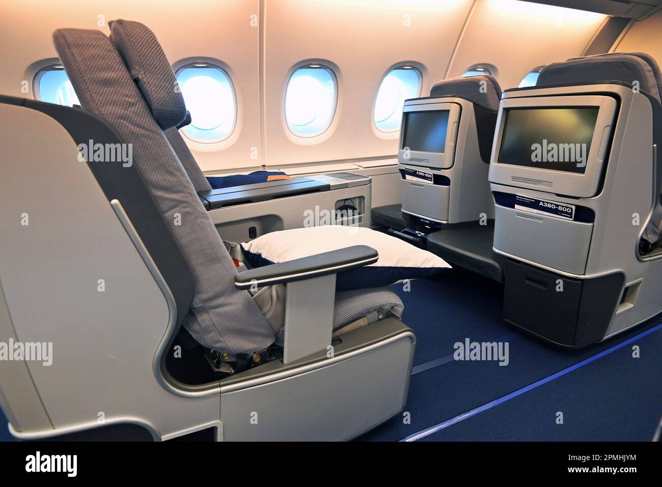 Lufthansa Airbus A380 long-haul aircraft will land again for the first time in Munich at Franz Josef Strauss Airport on April 12, 2023. Business class, rows of seats, seats, seats, empty airplane cabin with no passengers. ? Stock Photo