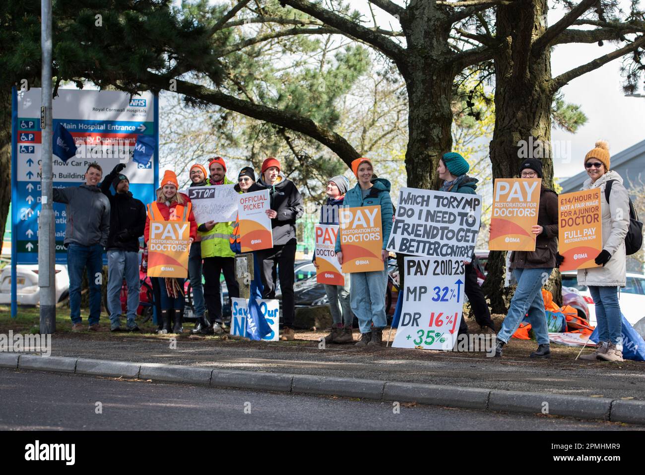 Truro, UK. 13th Apr, 2023. A group of Junior Doctors stand on a Picket Line outside The Royal Cornwall Hospital, Truro holding Placards stating ‘Pay Junior Doctors' along with others during the demonstration. This is as Junior Doctors stage a 4 day strike over pay and work conditions at the NHS. (Photo by Benjamin Gilbert/SOPA Images/Sipa USA) Credit: Sipa USA/Alamy Live News Stock Photo