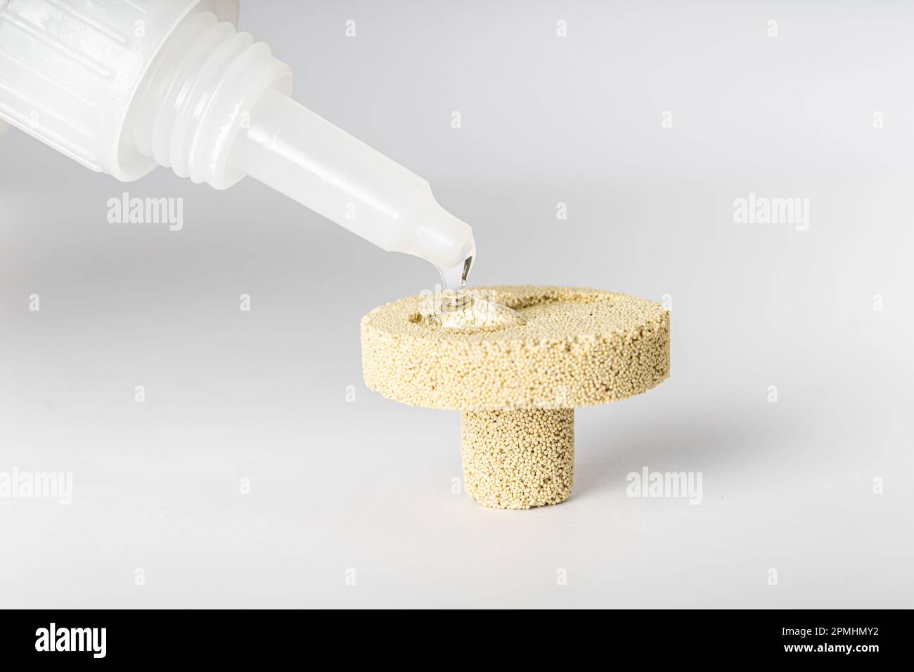 Base made of porous ceramic for fixing corals, widely used in marine aquariums. Using instant glue to fix the coral. Stock Photo