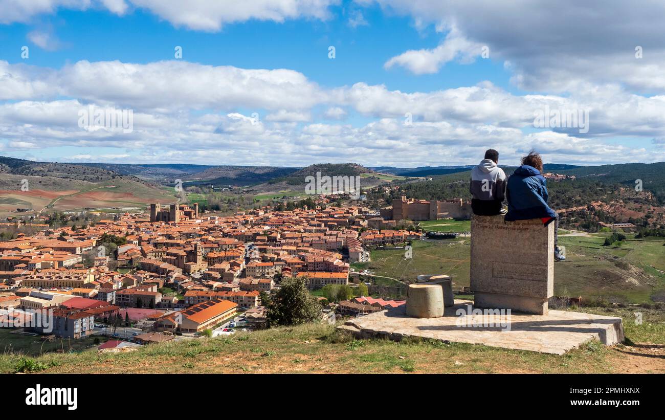Tourists strolling around the Castilian town of Sigüenza in Guadalajara, Spain, on a sunny day. Stock Photo