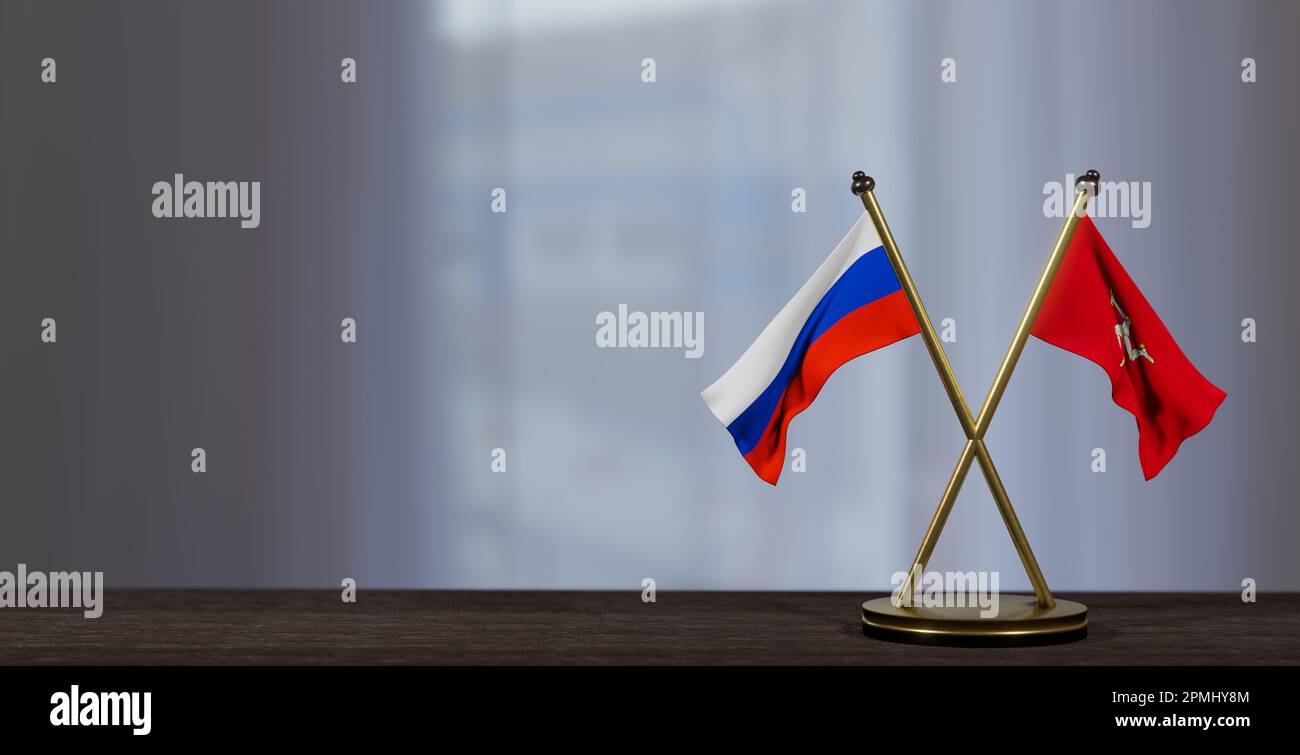 Russia and Isle of Mann flags on table. Negotiation between Isle of Mann and Russia. on little blur background. 3D work and 3D image Stock Photo