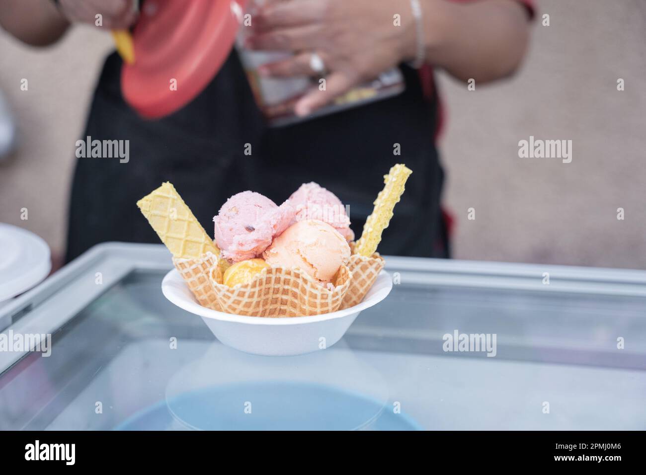 An Hispanic adult woman is preparing a traditional Mexican ice cream