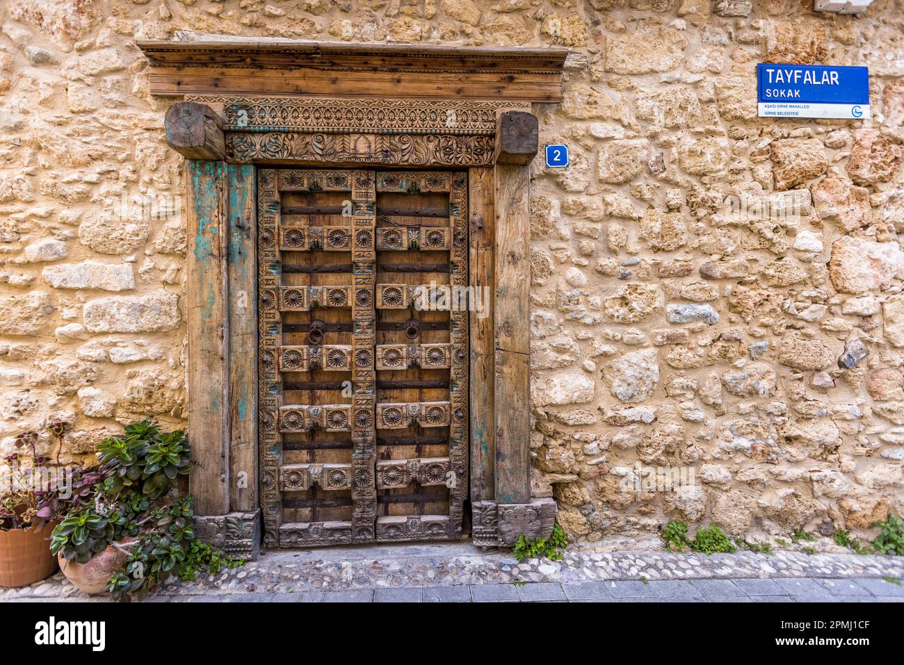 Old heavy wooden door in Kyrenia, Cyprus Stock Photo