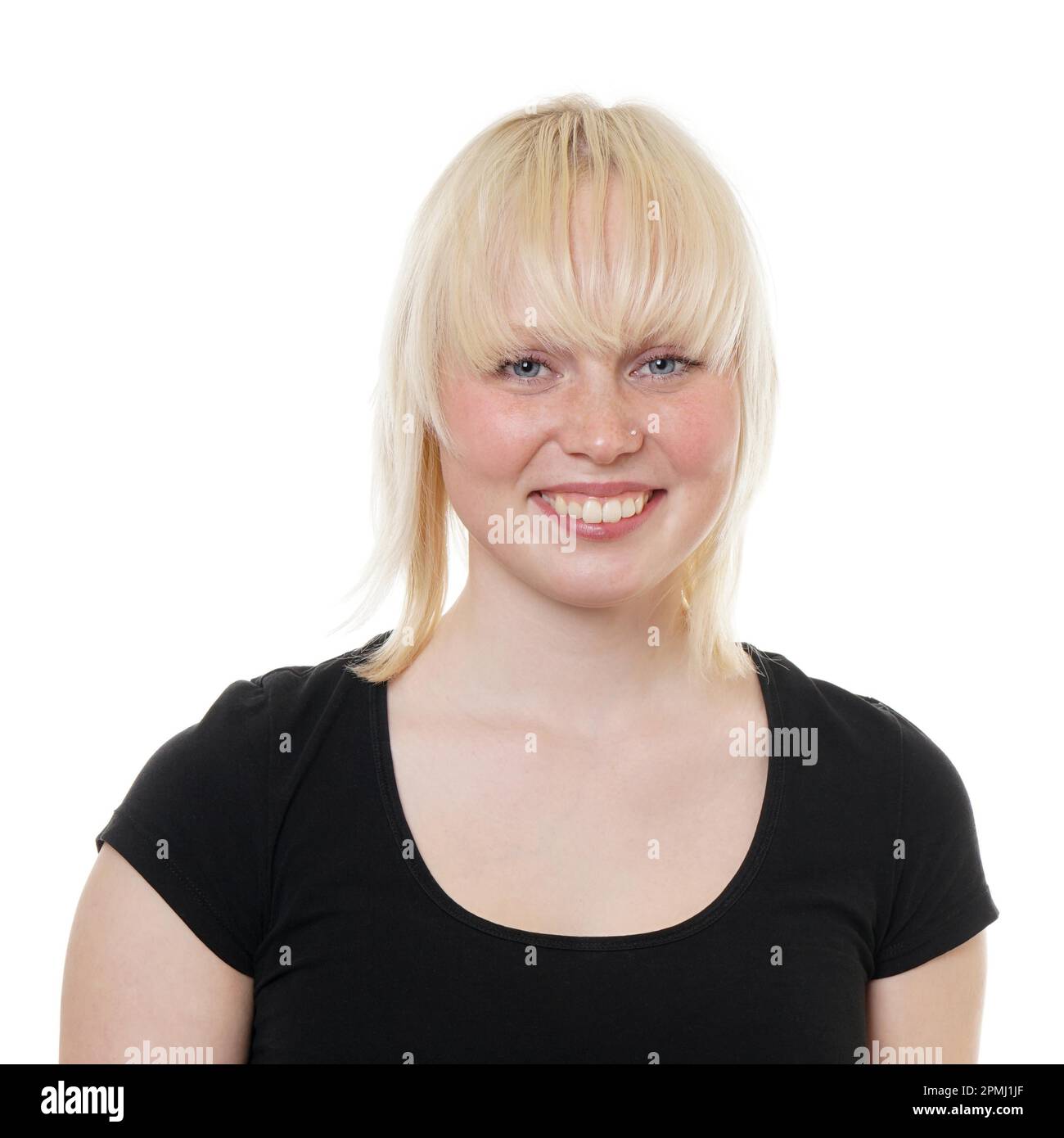 happy young woman with toothy smile and light blond or tow-colored hair Stock Photo