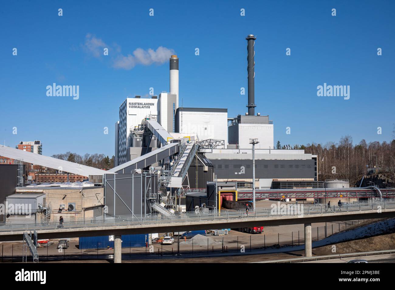 Naistenlahden voimalaitos or Naistenlahti Power Plant against clear blue sky on a sunny spring day in Tampere, Finland Stock Photo